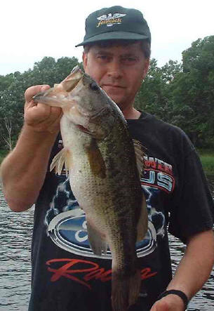 John W. with a good bass caught from one of our docks, 2001.
