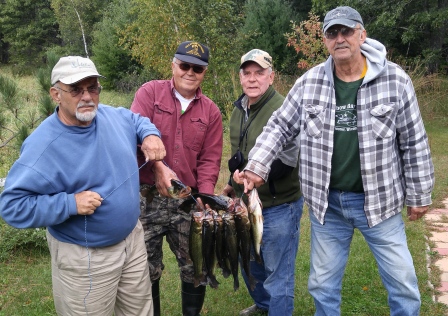 Ken, Rich, Ed, and George with some bass from a nearby lake, September 2015.