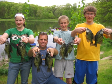 Sarah B., Paul S., Ben C., and Jake C. with some 10-12 inch crappies from Benoit Lake, May 29, 2011.