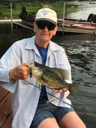 Bob W. with a trophy crappie that he caught from the dock and then released.  May, 2023.