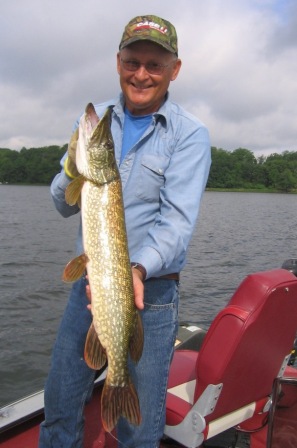 Dave with a 30 inch pike, released.  July, 2015, Benoit Lake.