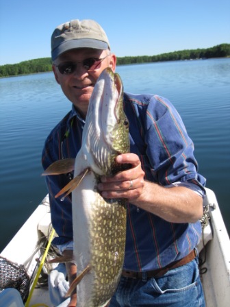 Dave C. with a 32 inch northern pike he caught and release on May 31, 2010 in Benoit Lake.  The fish took a Thumper Tail spinner.  Jake C. is the photographer.
