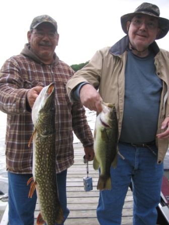 David and Bill Appleby with a nice northern pike and bass that they caught and released on Benoit Lake, September 2008.