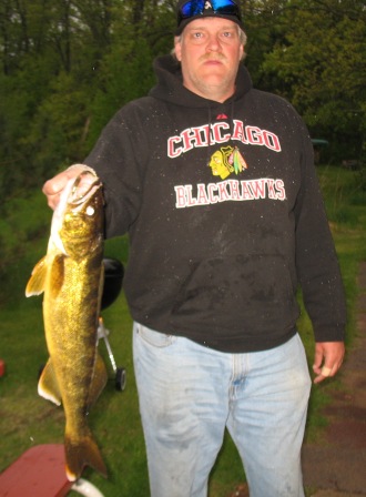 George Caithamer, my cousin, with a nice 23.5 inch walleye from an area lake, May 27, 2011.