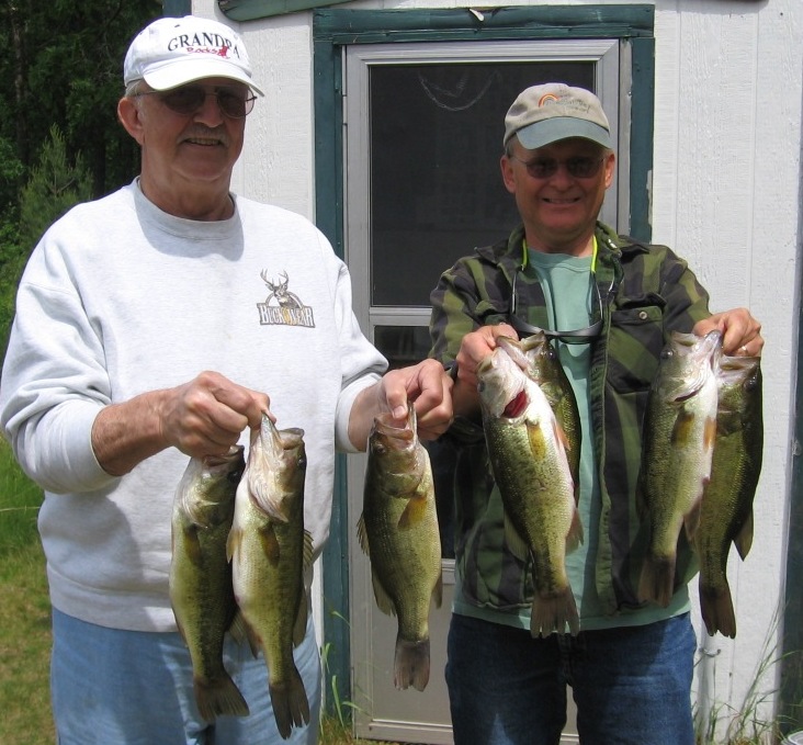 George and I released these bass into hot oil for our annual family reunion fish fry.  The bass were taken on plastic worms over weeds on Benoit Lake, June 12, 2011.