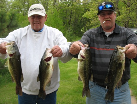 George Caithamer and his son George with 4 nice bass from an area lake, May 27, 2011.