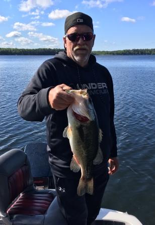 George C. with another nice Burnett County bass, June, 2020.  C&R.