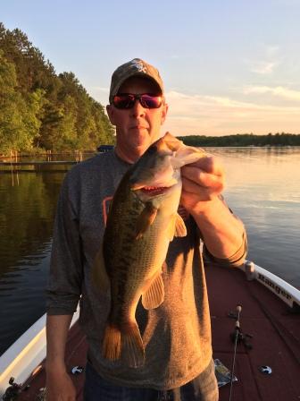Mark C. with a great bass from a Burnett County Lake.  C&R