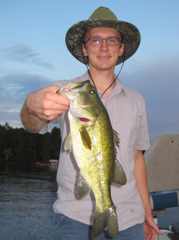 Jacob C. caught this nice bass on a nearby lake.  He was pitching a plastic worm.  August, 2019.