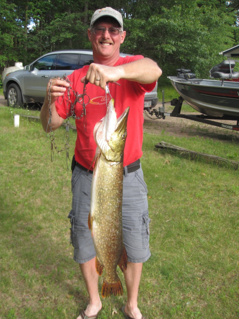 Dave B. with a 34-inch pike he and Carolyn caught on a nearby lake, June, 2017.