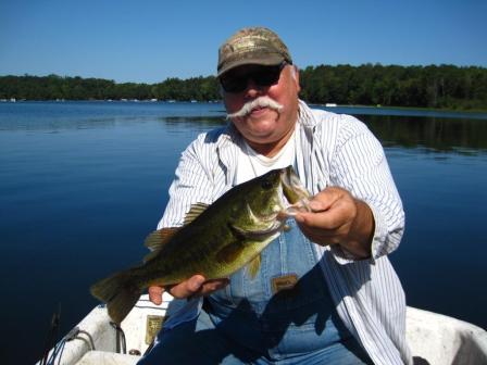 Terry W. with a Burnett County largemouth bass, August 2017.