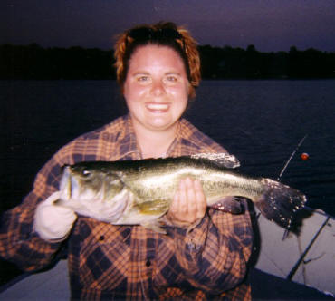 Jeanette with a wonderful bass she caught and released in our bay.