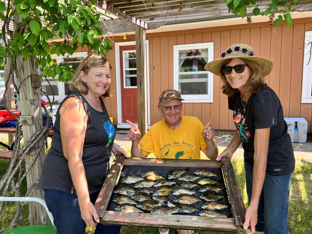 Janet and Judy with bluegills, Rainbow Bay Resort, Benoit Lake, Burnett County, Wisconsin, June 2023