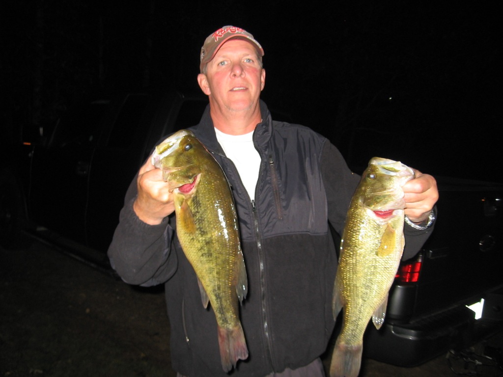 Mark C. with a pair of dandy bass from a nearby lake, October 4, 2013.
