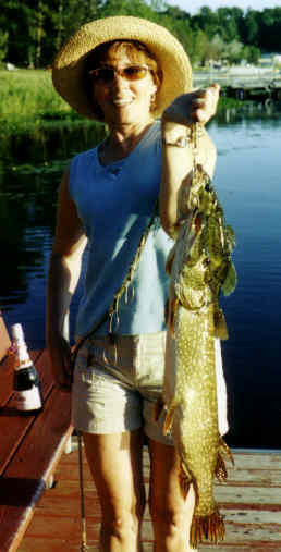 Mary C. with a nice pike from adjoining Rice Lake, summer 2004.