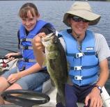 Megan and Jake with a 16 inch bass caught at Rainbow Bay Resort on Benoit Lake, August, 2008.
