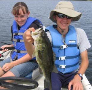 Jake C. with a 16-inch bass he caught at Rainbow Bay Resort.  Megan K. was pleased that he released this fish.