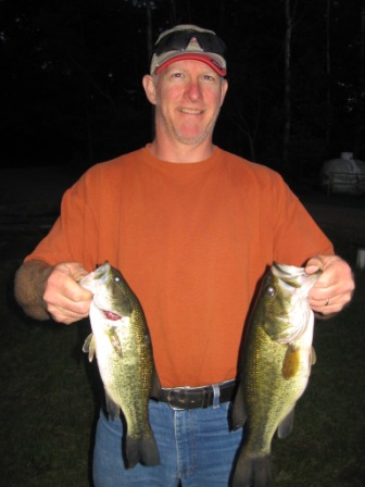 Mike D. with a couple of nice bass from Benoit Lake, June 7, 2012.