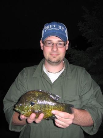 Nate Gassen with a 9.5 inch, resort-record pumpkinseed that he caught on May 26, 2009.