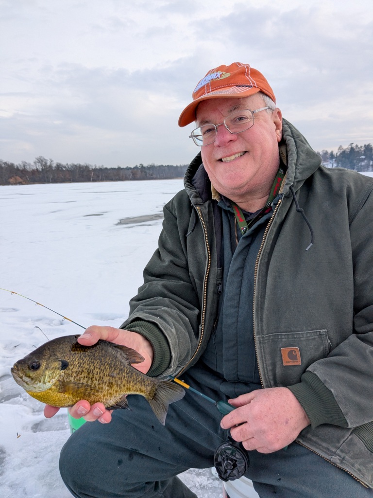 Bryan A. with a nice bluegill from a Burnett County Lake, Feb 2, 2025.