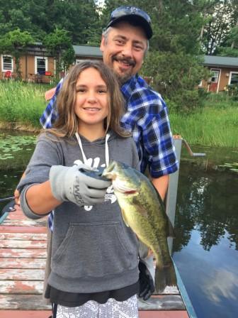 Scarlet caught this nice bass off the dock.  Dad (Denise) enjoys the moment.  June 2021