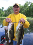 Ted J. with 4 nice bass from Benoit Lake, spring 2007.