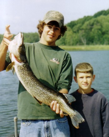 Trent and Tyler J. with a nice pike from our lake, August 2004.