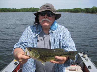 Terry W. with a beautiful bass from Benoit Lake, June 2020.  C&R
