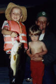 Jake with an 18 inch bass he caught and released.  That's Ben and Dave in the photo too.