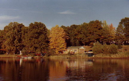 The view of Rainbow Bay Resort from Benoit Lake, fall 2002.